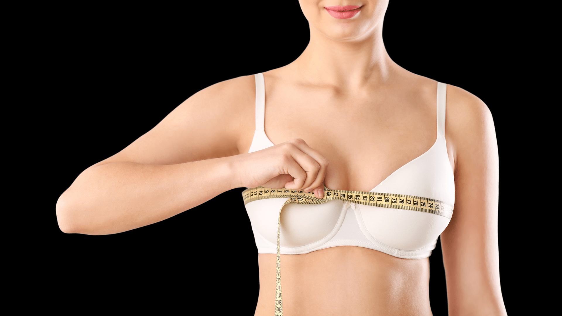 Female breasts in bra after augmentation or breast size correction
